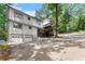 Exterior view of a two-story house with a wooden deck and a driveway at 800 Breckinridge Sw Rd, Marietta, GA 30064