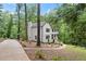 Charming two-story home with painted brick foundation, lush landscaping and winding driveway at 800 Breckinridge Sw Rd, Marietta, GA 30064