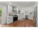 Contemporary kitchen featuring white cabinets, stainless steel appliances, and hardwood floors at 800 Breckinridge Sw Rd, Marietta, GA 30064