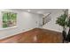 Cozy living room showcasing hardwood floors, natural light, and a staircase at 800 Breckinridge Sw Rd, Marietta, GA 30064