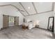 Spacious main bedroom with vaulted ceiling, wooden beams, and sliding barn door at 800 Breckinridge Sw Rd, Marietta, GA 30064