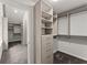 Large walk-in closet with custom shelves and drawers for optimal storage solutions at 800 Breckinridge Sw Rd, Marietta, GA 30064