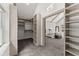 Open walk-in closet boasts custom shelving and convenient access to the main bedroom at 800 Breckinridge Sw Rd, Marietta, GA 30064