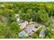 Aerial view of a neighborhood featuring the pool, hot tub and home's layout amid mature trees at 1928 Main Nw St, Atlanta, GA 30318