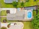 Beautiful aerial view of the home with a pool, hot tub, and expansive yard in a leafy neighborhood at 1928 Main Nw St, Atlanta, GA 30318