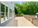 Spacious back deck ideal for outdoor entertaining with scenic backyard views and access to the pool at 1928 Main Nw St, Atlanta, GA 30318