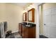 Bathroom with double vanity with undermount sinks, framed mirrors, and dark wood cabinets at 1928 Main Nw St, Atlanta, GA 30318