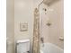 Cozy bathroom features a toilet, tub/shower combination and decorative shower curtain at 1928 Main Nw St, Atlanta, GA 30318