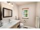Modern bathroom featuring a bright vanity, neutral color palette and natural light at 1928 Main Nw St, Atlanta, GA 30318
