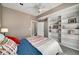 Comfortable bedroom featuring built-in shelves and soft decor accents at 1928 Main Nw St, Atlanta, GA 30318