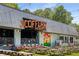 A lively brewery with outdoor seating and vibrant signage, perfect for a social gathering at 1928 Main Nw St, Atlanta, GA 30318