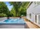 Inviting hot tub with adjacent deck and backyard views, perfect for relaxing after a long day at 1928 Main Nw St, Atlanta, GA 30318