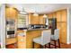 Updated kitchen with stainless steel appliances, granite countertops, and breakfast bar seating at 1928 Main Nw St, Atlanta, GA 30318