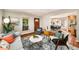 Cozy living room featuring hardwood floors, a large window, and an open layout at 1928 Main Nw St, Atlanta, GA 30318