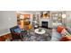 Open concept living area with hardwood floors, fireplace, and seamless flow to the kitchen at 1928 Main Nw St, Atlanta, GA 30318