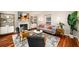 Stylish living room with hardwood floors, fireplace, and comfortable seating arrangement at 1928 Main Nw St, Atlanta, GA 30318