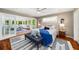 Bright main bedroom featuring hardwood floors, ceiling fan, and an attached sunroom at 1928 Main Nw St, Atlanta, GA 30318