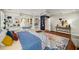 Spacious main bedroom with hardwood floors, ceiling fan, built-in shelves, and window seat at 1928 Main Nw St, Atlanta, GA 30318