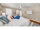 Bright main bedroom featuring hardwood floors, ceiling fan, and closet access at 1928 Main Nw St, Atlanta, GA 30318