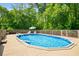 Sparkling pool surrounded by a wooden deck and lush greenery, perfect for relaxation and recreation at 1928 Main Nw St, Atlanta, GA 30318
