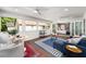 Bright and airy sunroom with white walls, tile floors, and access to main bedroom at 1928 Main Nw St, Atlanta, GA 30318