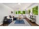 Bright and airy sunroom with white walls, tile floors, and large windows overlooking greenery at 1928 Main Nw St, Atlanta, GA 30318