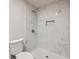 Bathroom featuring a toilet and a shower with white marble tile at 2091 Parker Ranch Se Rd, Atlanta, GA 30316