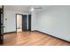 Bedroom with hardwood floors and two doorways, one leading to the bathroom at 2091 Parker Ranch Se Rd, Atlanta, GA 30316