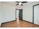 Bright bedroom featuring hardwood floors, ceiling fan and a closet with bi-fold doors at 2091 Parker Ranch Se Rd, Atlanta, GA 30316