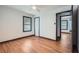 Well-lit bedroom featuring hardwood floors, closet, and natural light from the window at 2091 Parker Ranch Se Rd, Atlanta, GA 30316