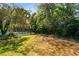 View of backyard and fenced tennis court at 27 Lakes Edge Se Dr, Smyrna, GA 30080
