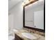 Bathroom vanity features a granite countertop, dark wood cabinets, and bright lighting at 27 Lakes Edge Se Dr, Smyrna, GA 30080
