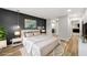 Modern bedroom with black accent wall, stylish lighting, and view of the bathroom at 27 Lakes Edge Se Dr, Smyrna, GA 30080
