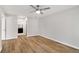 Spacious bedroom with light gray walls, modern flooring, and an attached bathroom at 27 Lakes Edge Se Dr, Smyrna, GA 30080