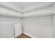 Walk-in closet with shelving and hanging rods at 27 Lakes Edge Se Dr, Smyrna, GA 30080