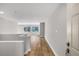 Inviting home hallway with wood flooring with view of the spacious living room at 27 Lakes Edge Se Dr, Smyrna, GA 30080