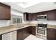 Stylish kitchen with stainless steel appliances and granite countertops at 27 Lakes Edge Se Dr, Smyrna, GA 30080