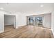 Bright living room with modern flooring and a sliding door leading to the outside at 27 Lakes Edge Se Dr, Smyrna, GA 30080
