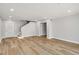 Open-concept living room with wooden floors and access to other rooms in the house at 27 Lakes Edge Se Dr, Smyrna, GA 30080