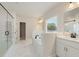 Modern bathroom with double sink vanity, free standing tub, and glass shower at 3301 Lions Ruby Ln, Atlanta, GA 30349