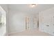 Bedroom featuring double door closet and neutral carpet at 3301 Lions Ruby Ln, Atlanta, GA 30349