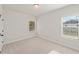 Bedroom featuring carpet, natural light, and neutral paint palette at 3301 Lions Ruby Ln, Atlanta, GA 30349