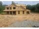Exterior of new home build showcasing wood frame structure and window placement at 3301 Lions Ruby Ln, Atlanta, GA 30349