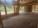 View of the interior construction of a large room with several framed-in window openings at 3301 Lions Ruby Ln, Atlanta, GA 30349