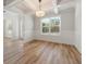 The living room features a decorative ceiling, wood floors, and lots of natural light at 3301 Lions Ruby Ln, Atlanta, GA 30349