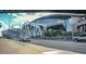 A busy street view of a stadium with modern architecture and vehicle traffic at 3301 Lions Ruby Ln, Atlanta, GA 30349