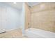 Clean bathroom featuring tiled shower and floors, and modern fixtures at 557 Lawton Sw St, Atlanta, GA 30310