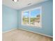 Bright bedroom with large windows overlooking the backyard at 557 Lawton Sw St, Atlanta, GA 30310