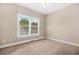 Neutral bedroom featuring carpet floors, window, and neutral walls at 557 Lawton Sw St, Atlanta, GA 30310