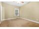 Bedroom featuring neutral walls, carpet flooring, and a window that lets in natural light at 557 Lawton Sw St, Atlanta, GA 30310